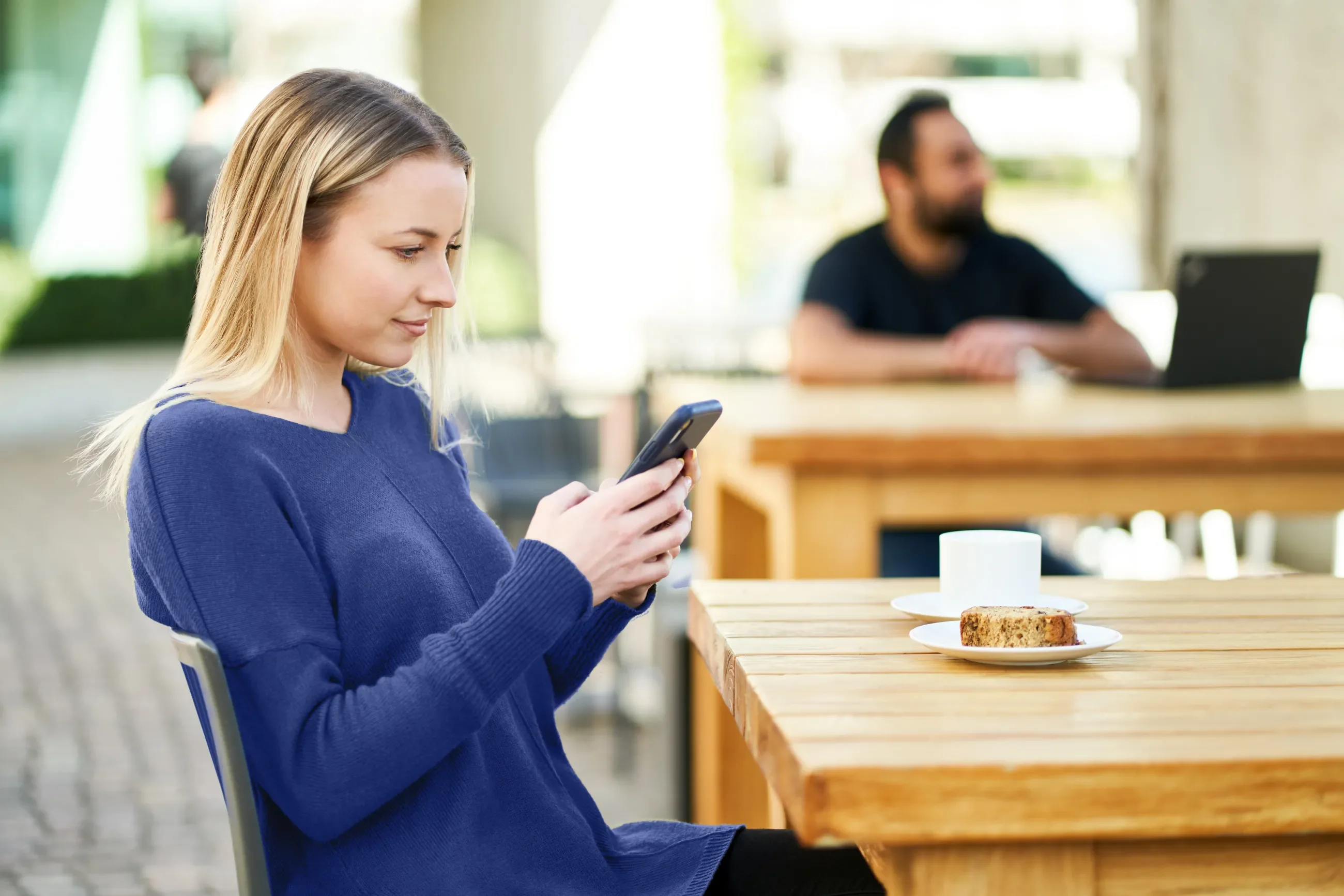 Person drinking coffee in a coffee shop